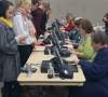 Joe Bryksa / Winnipeg Free Press
Grand Forks residents check in with election officials as they arrive to vote in the U.S. presidential election Tuesday afternoon at the Alerus Center.