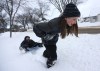 Trevor Hagan / Winnipeg Free Press
Kate Persson, 10, pulls her brother, Thomas, 6, in a sled in fresh snow in Transcona. While the snow had young folk out playing across Winnipeg, city crews will be out working to clear it off roads, with residential parking bans going into effect in some areas on Monday morning.