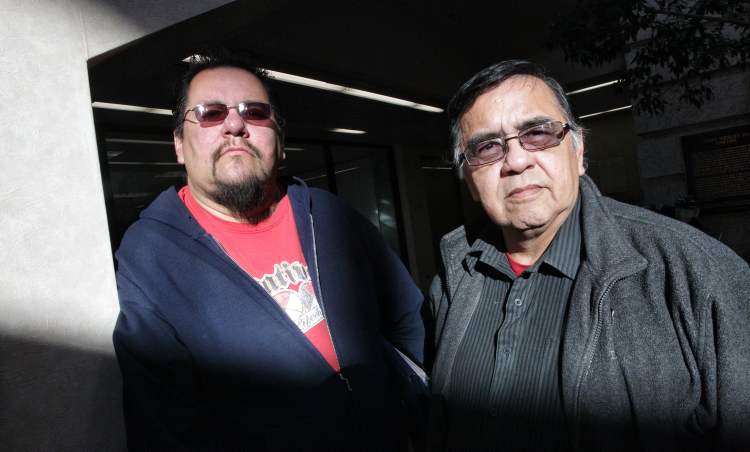 Mike Deal / Winnipeg Free Press
Buffalo Point First Nation band members, Elliott Cobiness (left) and Robert Kakaygeesick Jr. (right) think band chief, John Thunder, has gone too far by seeking an injunction that would make around 18 band members homeless if they don't stop a sit-in at the band's offices. On Friday it was announced that the injunction had been extended, but that protesters could return to their homes.