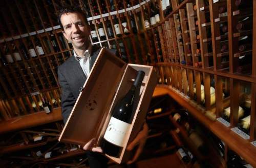 Phil Hossack / Winnipeg Free Press
Tom Bima, general manager of the Winehouse, shows one of the more expensive bottles he expects to sell over the holidays.