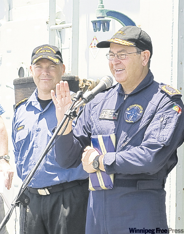 RICK AYER / FORMATION IMAGING SERVICE
Rear-Admiral Jose Domingos Pereira da Cunha (right) commends Cmdr. Craig Baines and crew.
