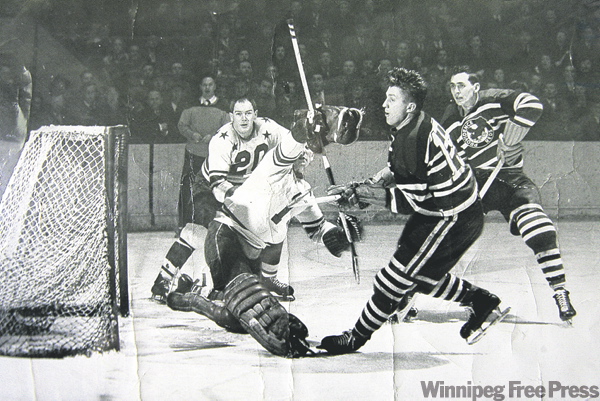 handout photo
Winnipeg's Pete Kapusta (19) pots a goal for the Providence Reds during the 1949 season.