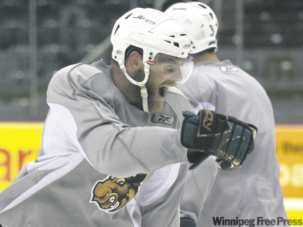 MIKE APORIUS / WINNIPEG FREE PRESS archives
Tommy Maxwell hams it up after scoring during Thursday's Moose workout at the MTS Centre. Manitoba takes on the Hershey Bears tonight in Game 6 of the Calder Cup final. Game 7, if necessary, is scheduled for Sunday night in Winnipeg.