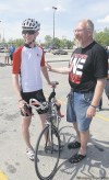 KEN GIGLIOTTI / WINNIPEG FREE PRESS
Wes Bauer, halfway in his cross-Canada ride against cancer, chats with dad Lyle.
