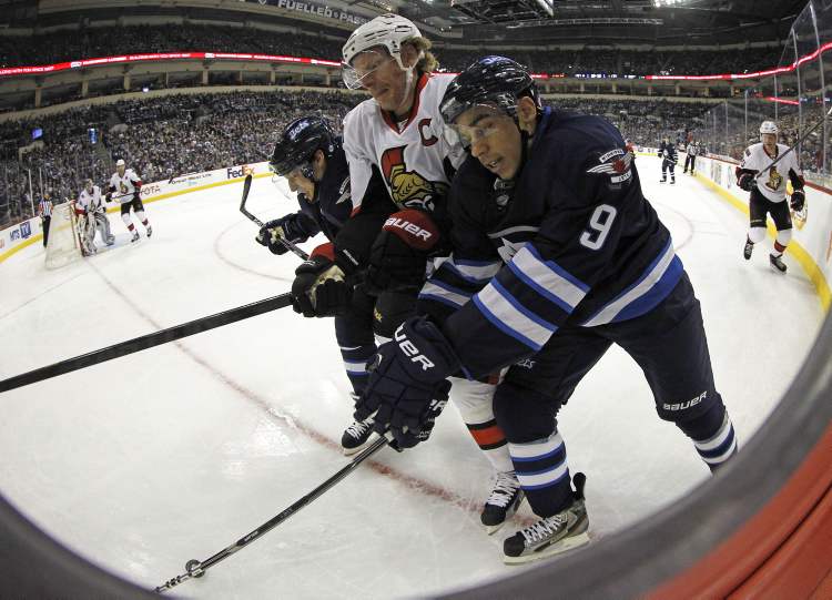 TREVOR HAGAN / WINNIPEG FREE PRESS
Winnipeg Jets' Kyle Wellwood and Evander Kane sandwich Ottawa Senators' Daniel Alfredsson during the second period of play at MTS Centre Saturday.