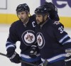 Joe Bryksa / Free Press files
Is there not a frank discussion to be had right now about whether Andrew Ladd, left, and Dustin Byfuglien, in particular, really are indispensable to a Jets team that has made the playoffs just once in the four seasons they’ve been in Winnipeg?