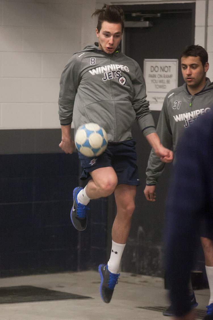 Melissa Tait / Winnipeg Free Pre
Alex Burmistrov controls the ball during Jets' traditional warm-up game of two-touch.