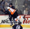 Phil Hossack / Winnipeg Free Press
Jets' Captain Andrew Ladd is crushed into the boards by Philadelphia Flyers' Wayne Simmonds in the first period at MTS Centre Tuesday night.