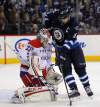 Phil Hossack / Winnipeg Free Press archives
Winnipeg Jets Captain Andrew Ladd battles with Washington Capitals goalie Braden Holtby in a game at the MTS Centre in March. Both Ladd and Holtby are contenders to play on Team Canada.