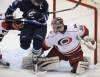 TREVOR HAGAN / WINNIPEG FREE PRESS
Carolina Hurricanes' Brett Bellemore (73) tries to clear Winnipeg Jets' Andrew Ladd (16) as he tries to screen a shot on Hurricanes goaltender Justin Peters (35) during the first period at the MTS Centre in Winnipeg, Saturday.