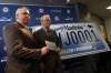 KEN GIGLIOTTI / Winnipeg Free Press
Winnipeg Jets True North Foundation executive director Dwayne Green (left) and Premier Greg Selinger announce the raffle of the first printed  Jets specialty licence plate # WJ0001.