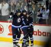 Phil Hossack / WInnipeg Free Press
Winnipeg's Blake Wheeler, Andrew Ladd  and Bryan Little celebrate a goal by Ladd against the Florida Panthers on April 11.