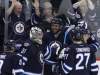MIKE DEAL / WINNIPEG FREE PRESS
The Jets' Dustin Byfuglien (centre) celebrates his game-winning goal in overtime with his fellow Jets at the end of their 4-3 win over the Carolina Hurricanes.