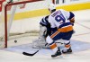 TREVOR HAGAN / WINNIPEG FREE PRESS
New York Islanders captain John Tavares puts the game-winning shootout goal past Winnipeg Jets goaltender Ondrej Pavelec Saturday.
