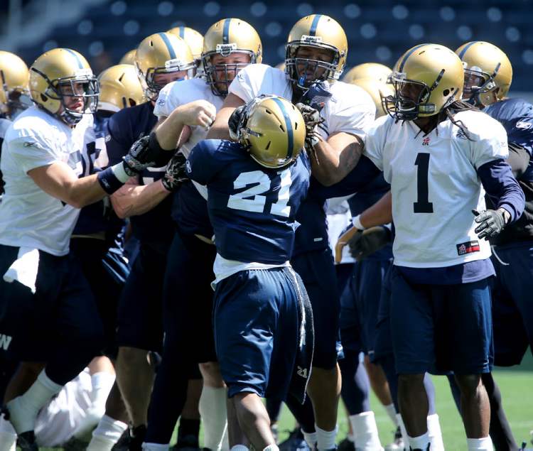 TREVOR HAGAN / WINNIPEG FREE PRESS
From left, Winnipeg Blue Bombers' Michel-Pierre Pontbriand (39), JT Gilmore (91), Justin Sorensen (68), Alex Suber (21), Shannon Boatman (60), and Kito Poblah (1) were involved in an altercation during practice that appeared to start with Kenny Mainor hitting Steve Morley across the face. Earlier in practice, Jameze Massey (80), and Quintin McCree (70), were also involved in another altercation during an eventful day at Investors Group Field.