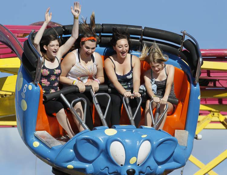 Winnipeg Free Press Archives
Ashton Wisener, Kyra DeLaRonde, Raeven O'Brien and Erica Reeves (from left) enjoy a ride on the Crazy Mouse at the Red River Ex.
John Woods / Winnipeg Free Press