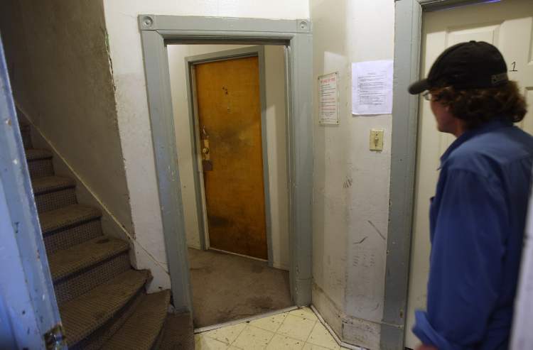 Joe Bryksa / Winnipeg Free Press
This Spence Street rooming house has 18 suites. Tenant Dave shows the tight hallways in the house.