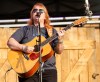 JESSICA BURTNICK / WINNIPEG FREE PRESS
Emily Sailers of the Indigo Girls plays on the main stage of the Winnipeg Folk Festival at Birds Hill Provincial Park Thursday.
