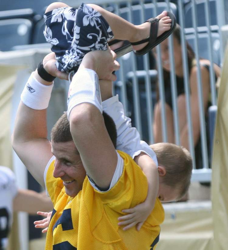 Joe bryksa / winnipeg free press
Backup QB Max Hall plays with three-year-old son Rex during Wednesday's practice at Investors Group Field.