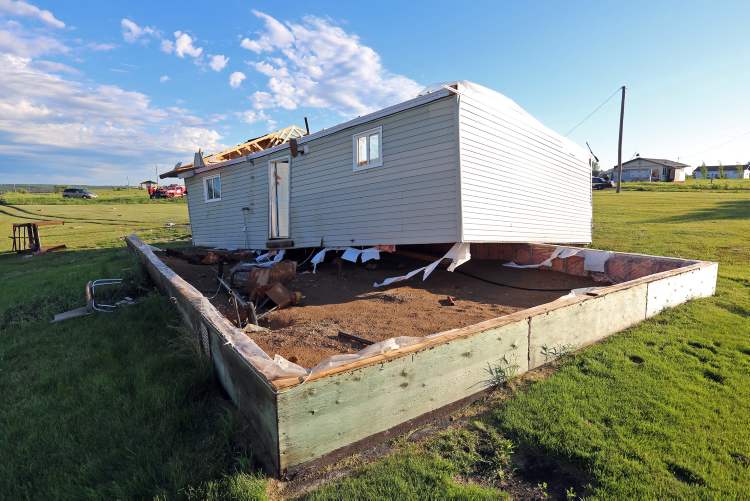 Colin Corneau/Brandon Sun
A home on the Sioux Valley Dakota Nation lies blown off of its foundation by a suspected tornado Thursday evening.