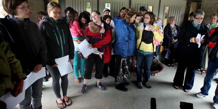 Phil Hossack / Winnipeg Free Press
A group of 30-40 people, mostly mothers and young children, gathered Thursday evening on Bedson Street at the Winnipeg Mennonite Elementary and Middle School to hold a vigil for Lisa Gibson and her two deceased children.