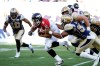 JESSICA BURTNICK / WINNIPEG FREE PRESS
Jon Cornish (#9) of the Calgary Stampeders is tackled by Kenny Mainor (#54) during the first quarter of Friday night's game at Investrs Group Field.