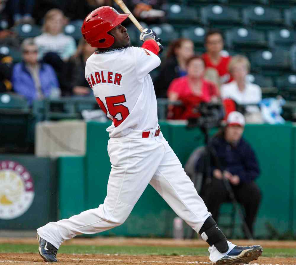 JESSICA BURTNICK/WINNIPEG FREE PRESS FILES
The Winnipeg Goldeyes' Ray Sadler watches the ball soar as the team faced off against the Sioux City Explorers at home on Wednesday, August 7, 2013. Sadler is one of seven players now signed for the Goldeyes' 2014 season.