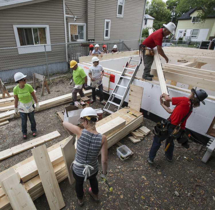 Volunteers building Habitat home on Langside Street Winnipeg Free Press