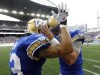 trevor hagan / winnipeg free press
James Green (left) celebrates with quarterback Justin Goltz after Goltz scored his first touchdown of the Banjo Bowl Sunday.