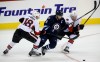trevor hagan / winnipeg free press
Ottawa Senators' Jim O'Brien, Winnipeg Jets' Andrew Ladd and Sens' Troy Rutkowski (right) battle for the puck during play at the MTS Centre on Sunday.