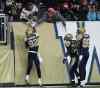 JOE BRYKSA / WINNIPEG FREE PRESS
Winnipeg Blue Bombers Terrence Edwards (left) gets a high five from fans as teammates Will Ford (centre) and Akkeem Foster look on after Edwards scored a touchdown against the Edmonton Eskimos during the first quarter of Friday night's game.