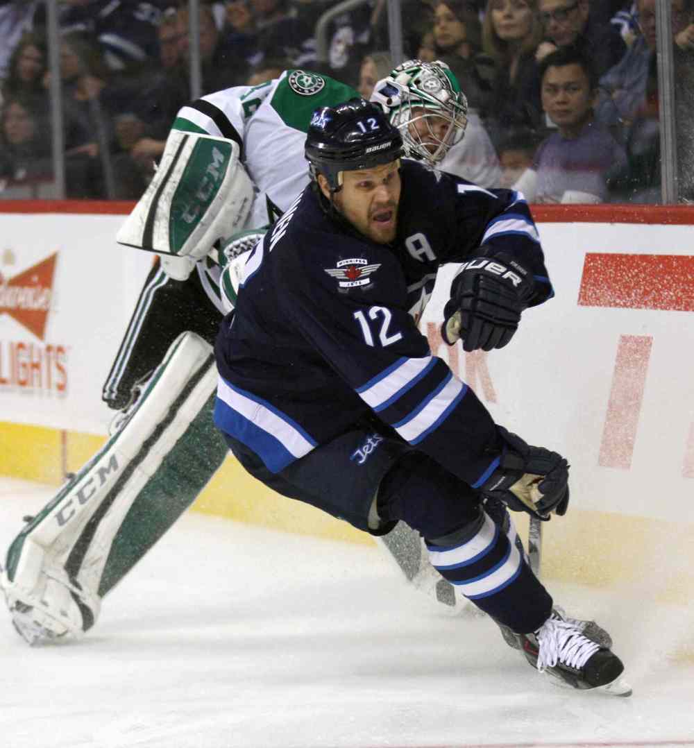 Joe Bryksa / Winnipeg Free Press
Winnipeg Jets Oli Jokinen gets tied up with Dallas Stars goaltender Kari Lehtonen during second period action Friday night at the MTS Centre.