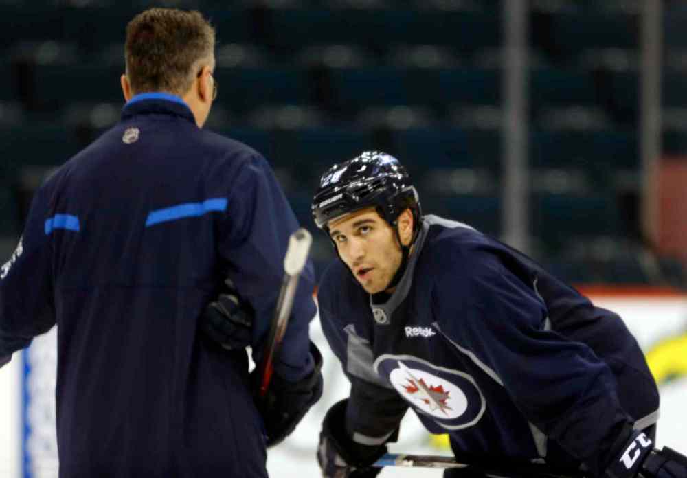 KEN GIGLIOTTI / WINNIPEG FREE PRESS
Head coach Claude Noel works with  recalled IceCap  Patrice Cormier Thursday. Noel has been juggling lines in a bid to spark the Jets to life, but may need to start taking more drastic  measures.