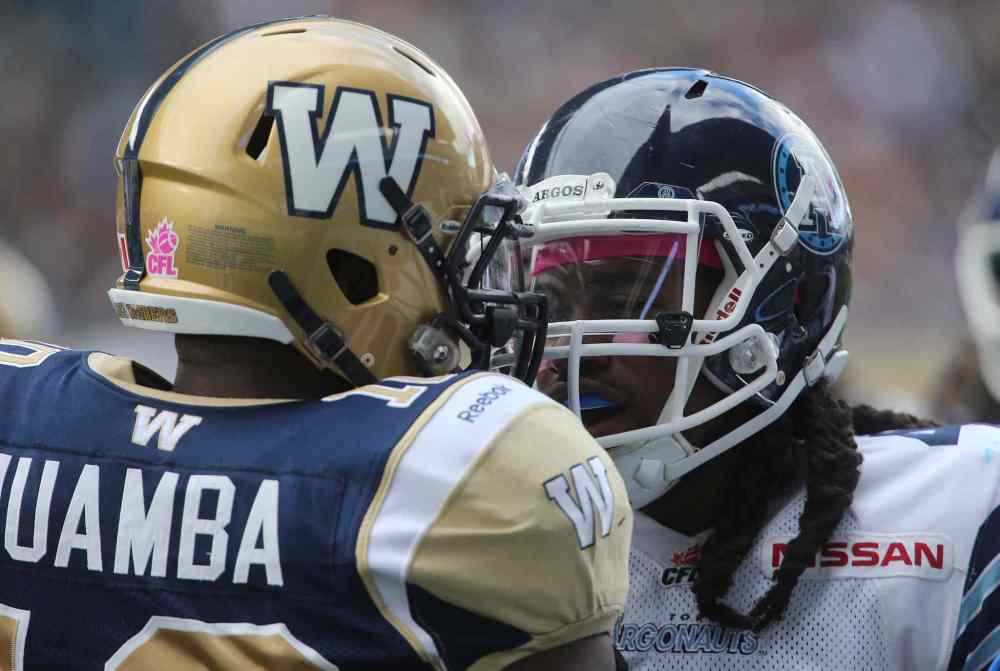 Trevor Hagan / Winnipeg Free Press
Winnipeg Blue Bombers' Henoc Muamba (10) and Toronto Argonauts' Jonathan Hood (41) get in each other's faces during the first half of CFL action at Investors Group Field Saturday.