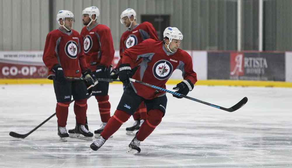 Mike Deal / Winnipeg Free Press
Winnipeg Jets' Mark Stuart (5) during practice at the MTS IcePlex Wednesday morning.