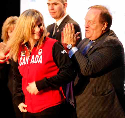 KEN GIGLIOTTI / WINNIPEG FREE PRESS
Marcel Aubut claps after giving Jennifer Jones her Olympic team jacket Monday. The Canadian Olympic Committee nominated Canada's winning curling teams, headed by Jennifer Jones  and Brad Jacobs respectively, to the Sochi Olympics.