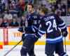 BORIS MINKEVICH / WINNIPEG FREE PRESS
Andrew Ladd (left) and Grant Clitsome share a laugh on the ice.