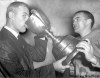 WINNIPEG FREE PRESS ARCHIVES
Blue Bombers coach Bud Grant tipples from the Grey Cup in 1958, with a helping hand from Keith Pearce.