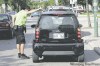 KEN GIGLIOTTI  / WINNIPEG FREE PRESS
Officer takes a few minutes to give directions to a driver on Broadway.