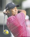 Carlos Osorio / the associated  press
Tiger Woods drove it straight but putted crooked on Thursday.