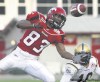 DEAN BICKNELL / CANWEST NEWS SERVICE
Calgary Stampeders receiver Titus Ryan (83) reaches for the ball in front of Winnipeg Blue Bombers defender Keyuo Craver during Saturday night's game at McMahon Stadium in Calgary.