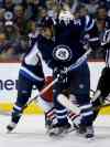 Trevor Hagan / Winnipeg Free Press
Winnipeg Jets' Dustin Byfuglien (33) tries to get out of the way of a point shot during second period NHL hockey action against the Columbus Blue Jackets' at MTS Centre in Winnipeg, Saturday, January 11, 2014. (TREVOR HAGAN/WINNIPEG FREE PRESS)