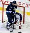Trevor Hagan / Winnipeg Free Press
Jets' Blake Wheeler gets in the face of Columbus Blue Jackets' goaltender Curtis McElhinney Saturday in Winnipeg. Wheeler says firing coach Claude Noel should be a 'wake-up call' for the underperforming Jets.