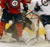 KEN GIGLIOTTI / WINNIPEG FREE PRESS
Goalie Al Montoya gets caught up in a traffic jam as the practices for the new coach get more intense. Montoya was not injured in the bump which knocked him over.