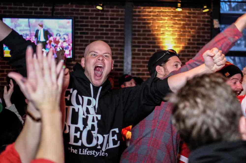MIKE DEAL / WINNIPEG FREE PRESS
Jordan Lombaert cheers at Confusion Corner Bar & Grill after Team Canada scores its second goal during the men's hockey gold-medal game against Sweden at the Winter Olympics Sunday morning.