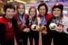 John Woods / Winnipeg Free Press
Olympic curling gold medalists Jennifer Jones (skip), Kaitlyn Lawes (third), Jill Officer (second), Dawn McEwen (lead), and their coach Janet Arnott (L) return to hundreds of family and supporters at the Winnipeg Airport Monday, February 24, 2014.