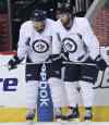 Joe Bryksa / Winnipeg Free Press
Jets Blake Wheeler (left) and Andrew Ladd take a breather during practice at the MTS Iceplex Tuesday.