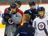 KEN GIGLIOTTI / WINNIPEG FREE PRESS
Jokinen (left), returned to the ice with his teammates to practice today after winning an Olympic bronze medal with Team Finland.