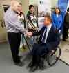 KEN GIGLIOTTI / WINNIPEG FREE PRESS
Rick Hansen, right, shakes hands with Scott Coates, who lives with a spinal cord injury he received 22 years ago. Manitoba is investing $3 million  over five years with the Rick Hansen Foundation to help people with spinal cord injuries recover and return to their homes and jobs.