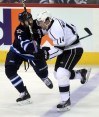 Phil Hossack / Winnipeg Free Press
Winnipeg Jets Mark Stuart takes Los Angeles Kings Justin WIlliams out of the play in first period action at the MTS Center Thursday.